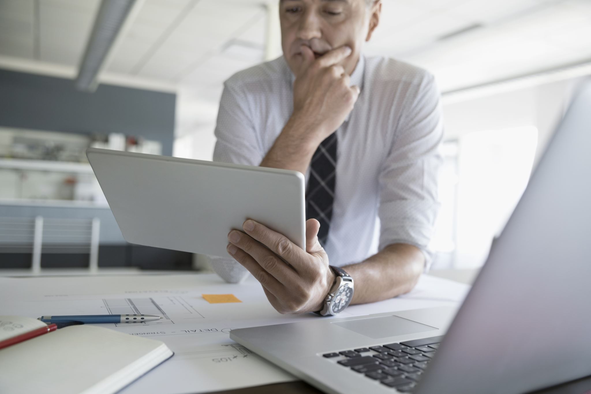 Businessman-looking-at-tablet